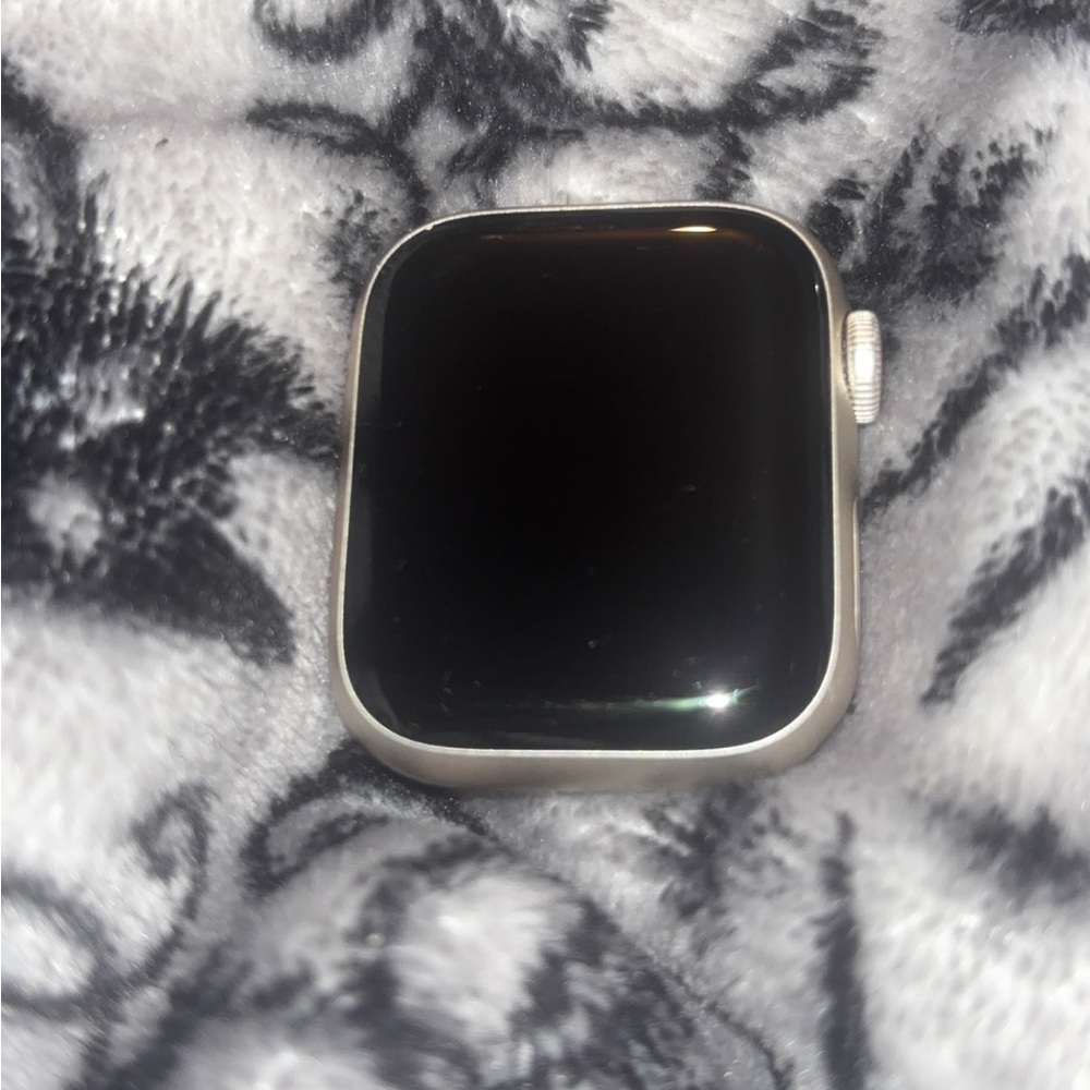 Apple Silver Smartwatch with Square Face and Black Display